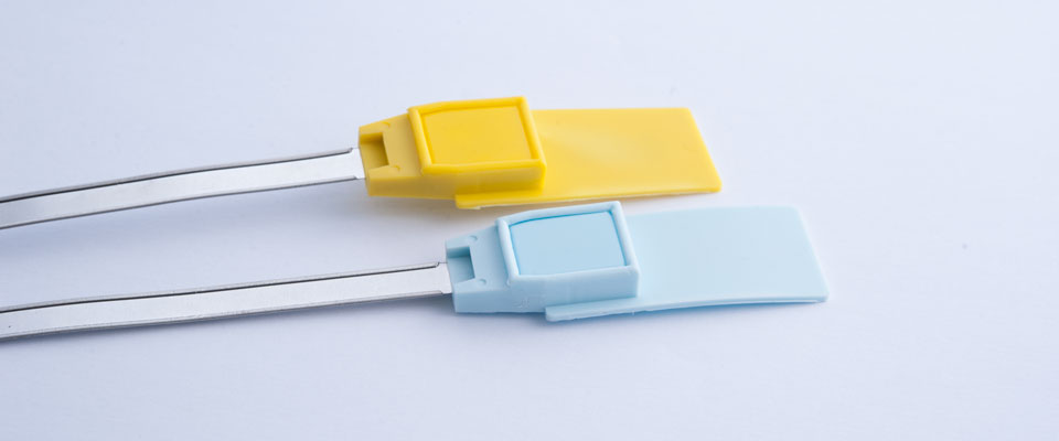 To enhance security, the metal locking system is encapsulated by plastic which is captured into the metal loop to prevent extraction.