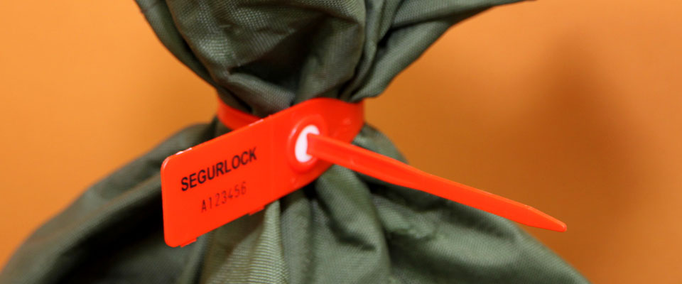 A versatile seal, the SegurLock is able to be used on many applications, including mail bags.