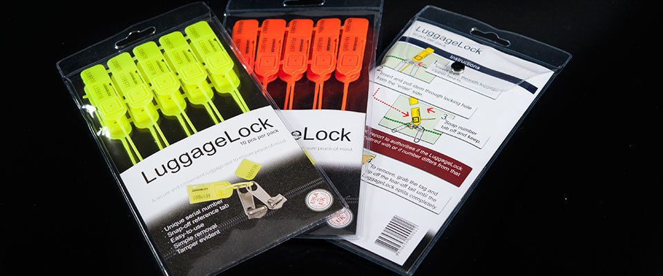 Featuring a modern design, the LuggageLock retail packaging accentuates the bright seals, while providing easy to follow instructions on the back.